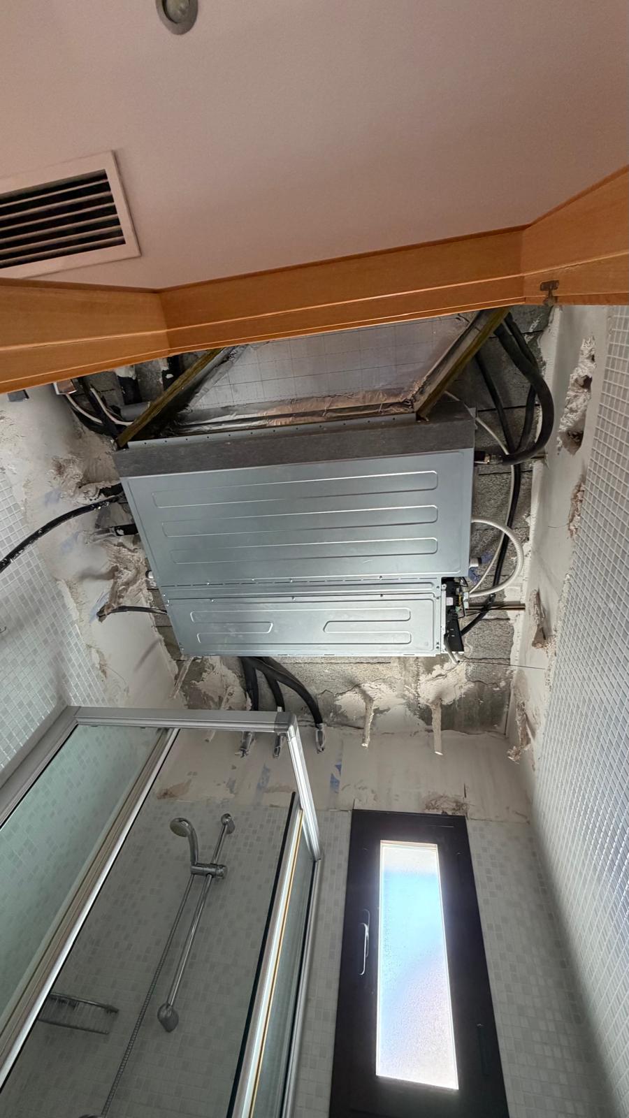 New Johnson concealed ducted indoor unit installed in the bathroom false ceiling in Mijas