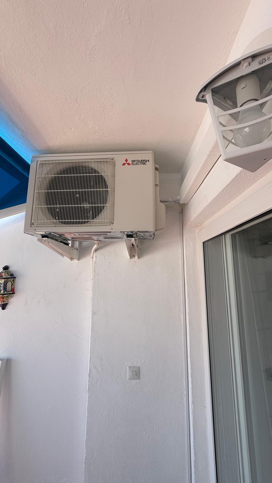 Close-up of installed Mitsubishi Electric MUZ-HR50VF2 outdoor unit, Torremolinos coastal apartment