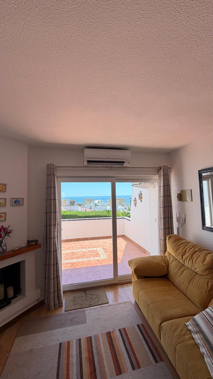 Torremolinos coastal apartment living room with new Mitsubishi Electric indoor unit and Mediterranean sea views